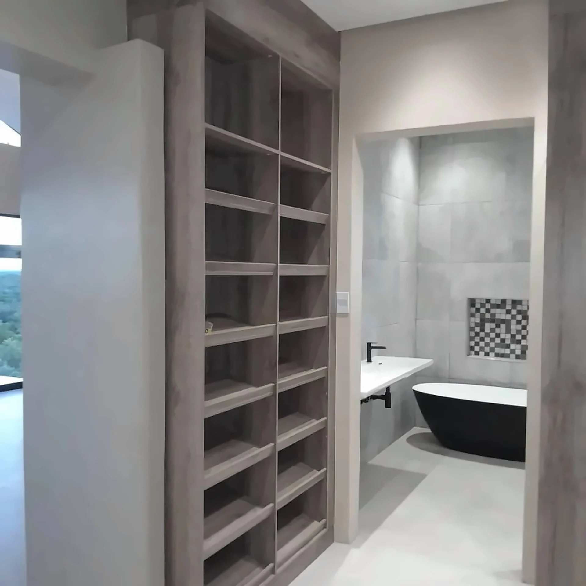 Tall cabinetry with open shelving in a dressing room