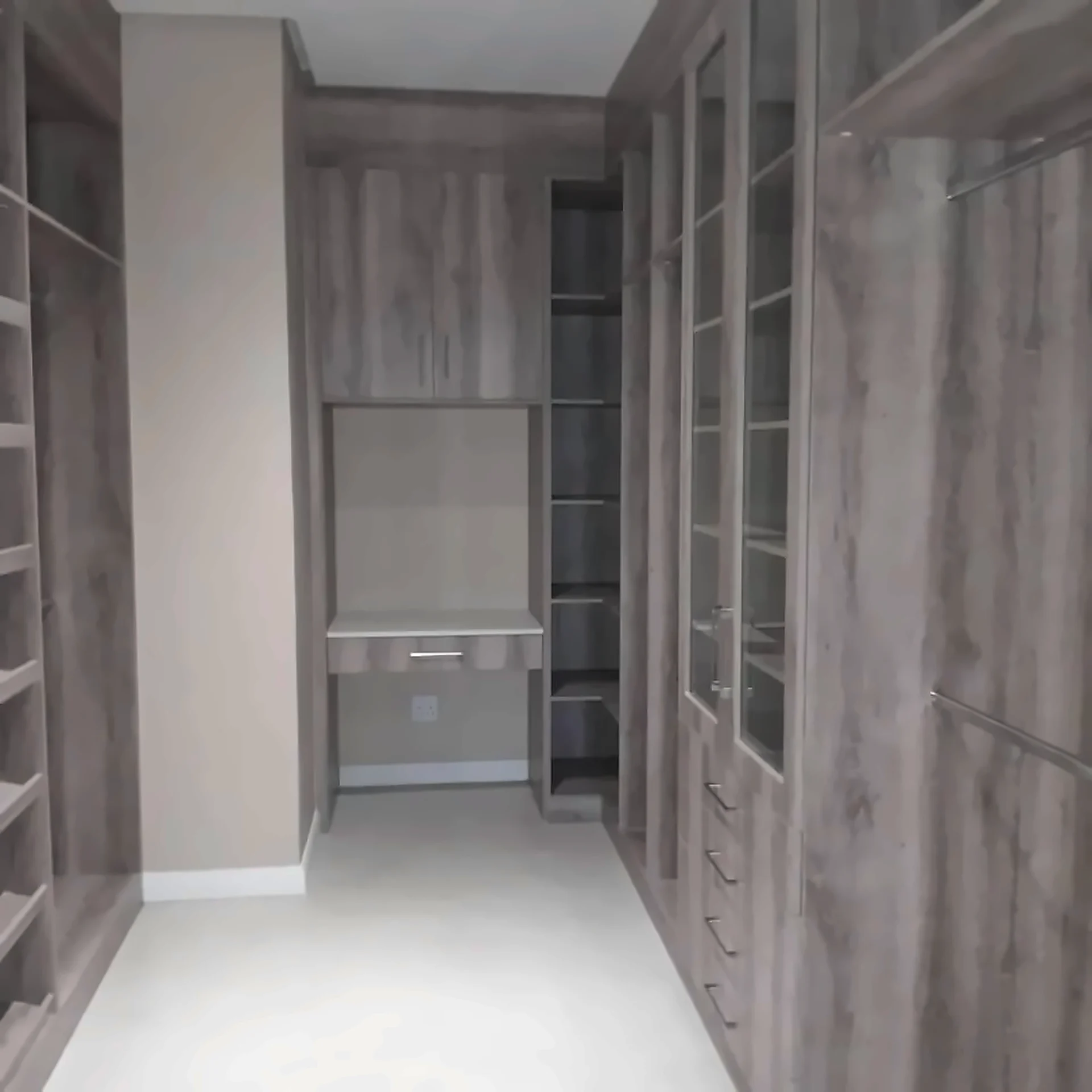 Built-in dressing room cabinetry with integrated shelving