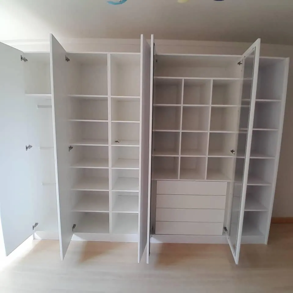 White wardrobe wall: Interior shelving and drawers