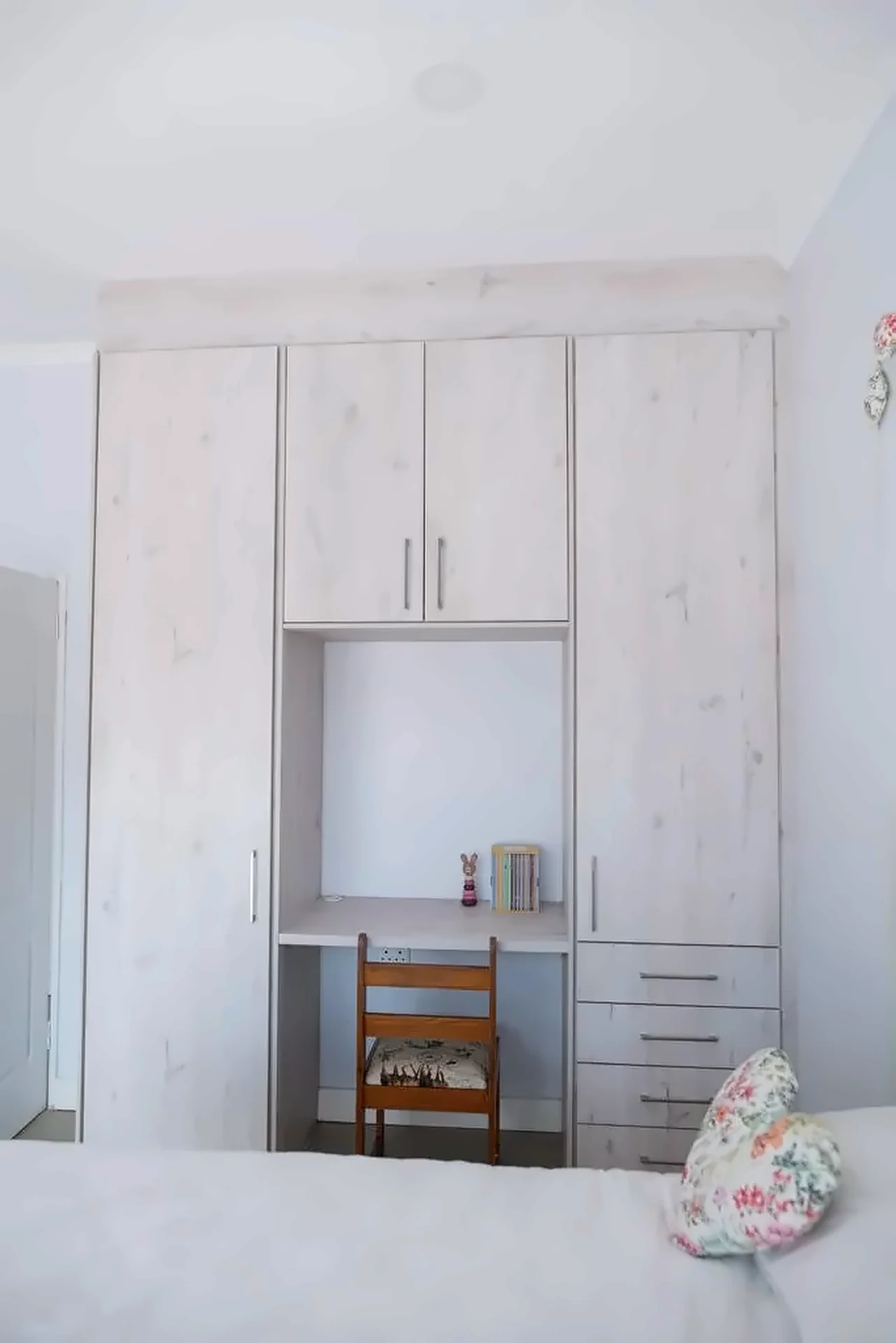 Wardrobe wall with integrated study desk